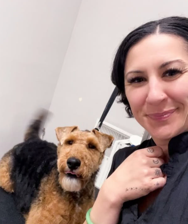 Annie Warren with a dog at We Love Paws